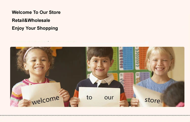 Three diverse children smiling and holding signs that say "welcome", "to", "our", and "store" in a classroom setting.