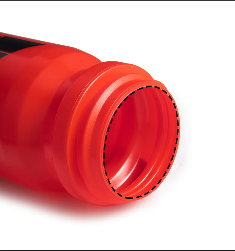 Close-up of an open, bright red sports water bottle showing the inner rim and threading against a white background.