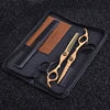 Gold 6-inch professional hairdressing scissors and thinning shears set with a matching comb in a black storage case.