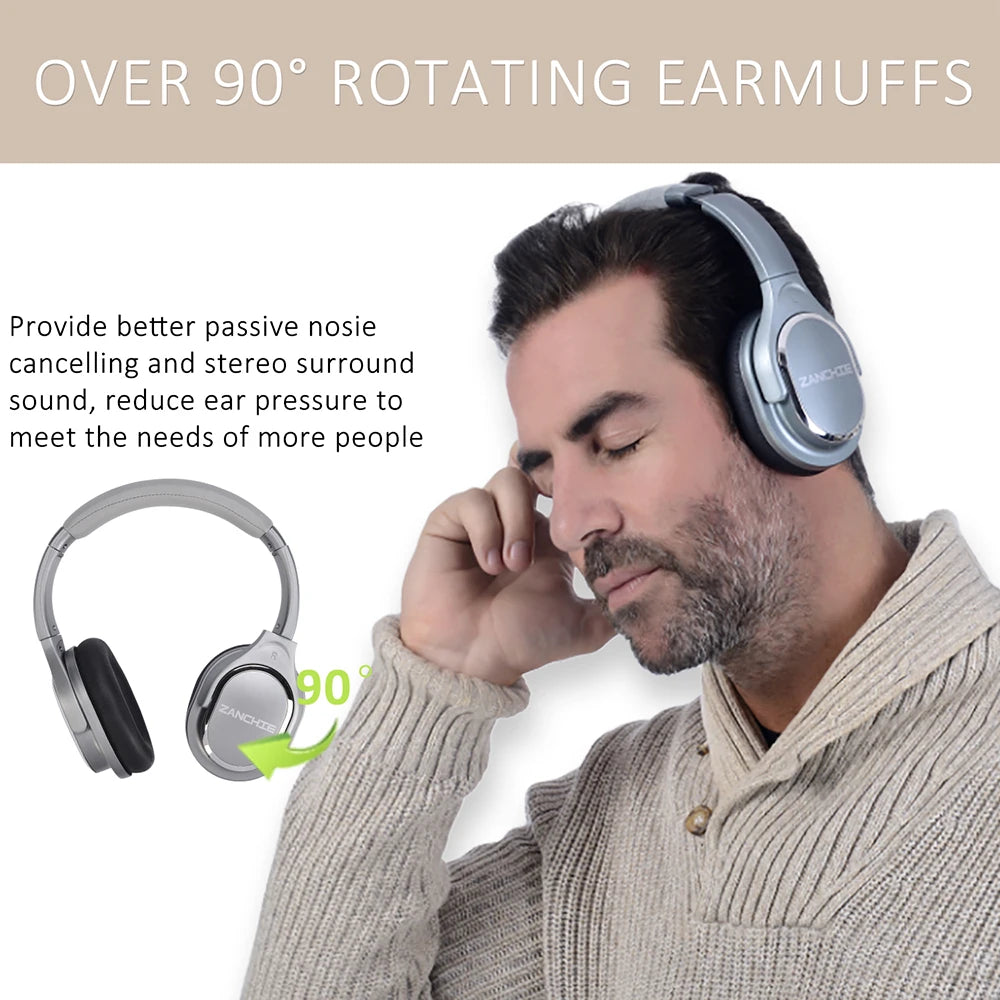 Man wearing sleek, grey over-ear wireless headphones with cushioned earcups that rotate 90 degrees for comfort.