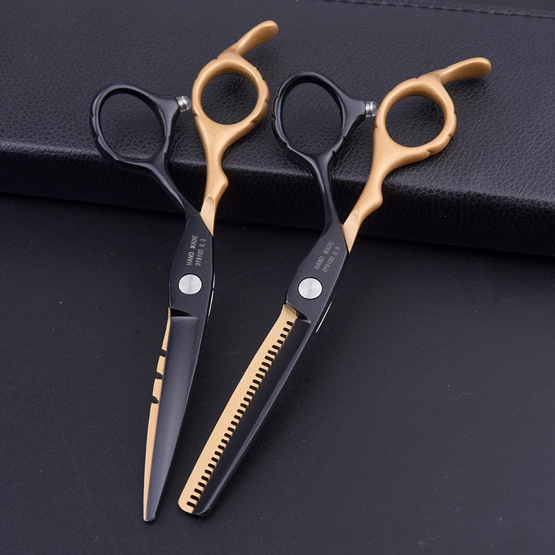 Professional 6-inch hairdressing scissors and thinning shears in a sleek black and gold finish.