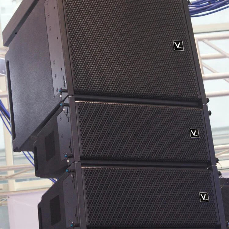 A stack of three professional black, full-range stage speakers with a durable metal mesh grille design.