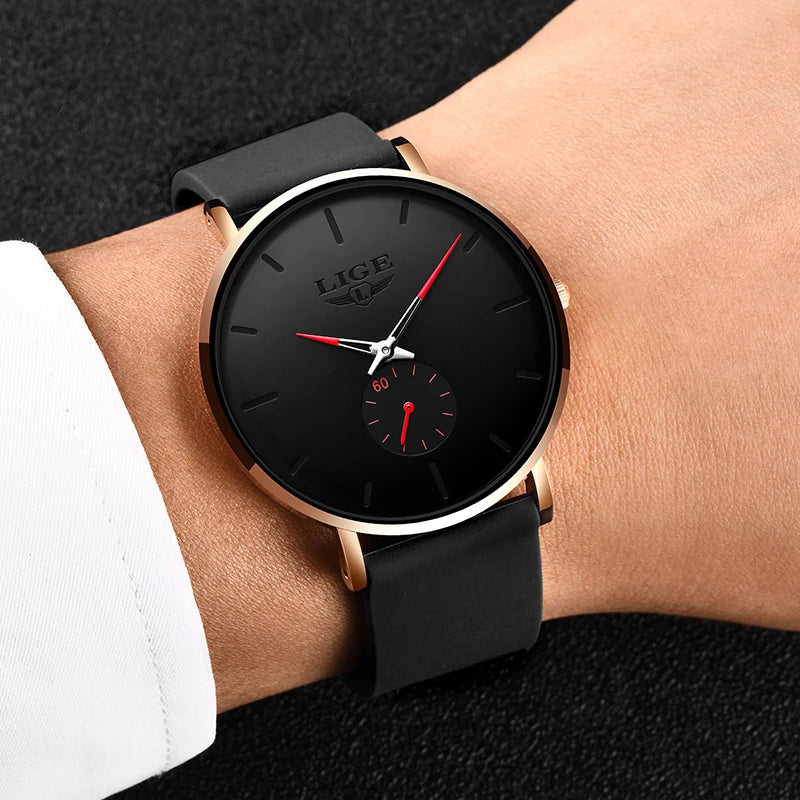 LIGE ultra-thin men's quartz watch with round black dial, rose gold case, red accents, and black silicone strap.