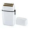 Compact white electric foil shaver with twin gold-tone blades and a matching protective cap.