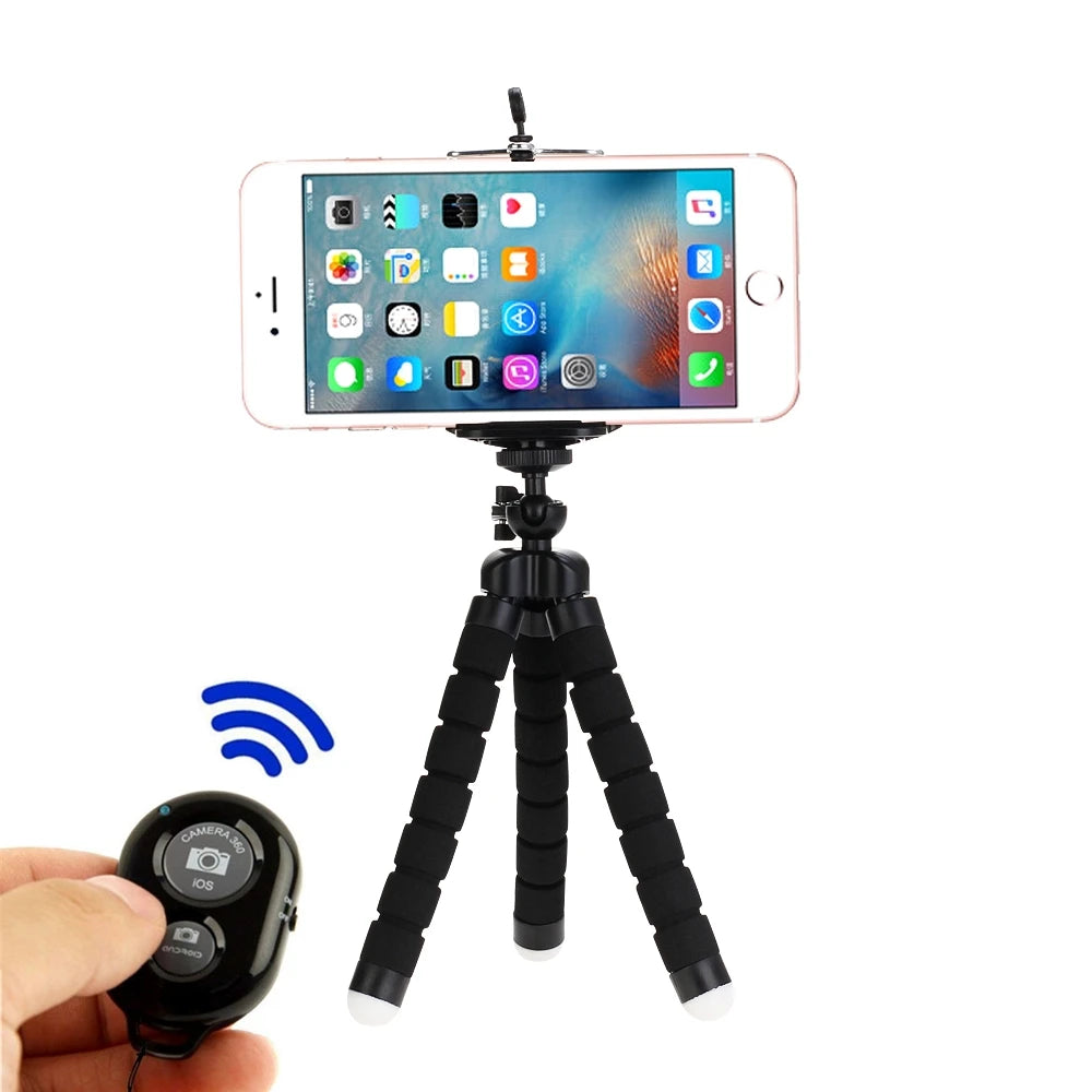 Black flexible tripod stand holding a smartphone with a wireless Bluetooth remote shutter control for photography.