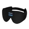 Black soft-touch sleep eye mask with built-in Bluetooth headphones and front control panel buttons.