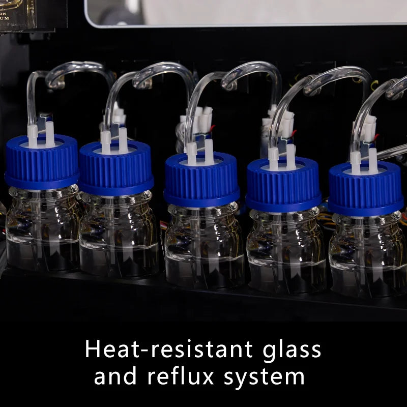 Internal view of a fragrance vending machine with five glass bottles featuring blue screw caps and clear tubing.