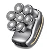 Gunmetal grey 7D electric head shaver featuring seven circular rotating shaving heads in a compact, ergonomic design.