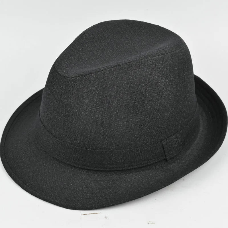 Classic black fedora hat with a fabric band and a structured, textured finish. Perfect for autumn and winter wear.