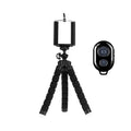 Flexible black phone tripod with universal phone mount and wireless Bluetooth camera remote shutter.