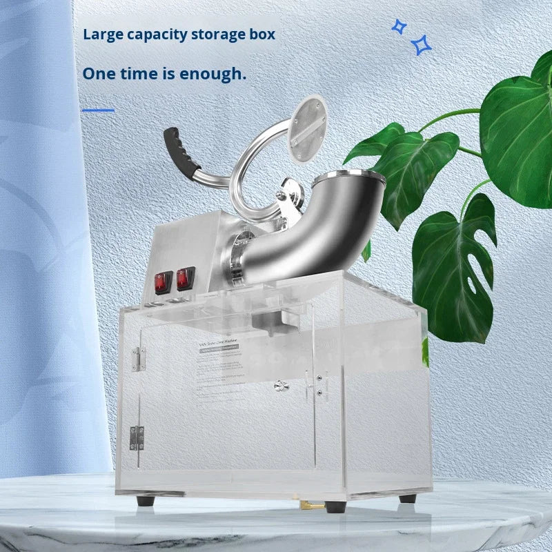 Stainless steel ice shaver with a clear acrylic storage box, featuring a top-mounted hand lever and power switches.