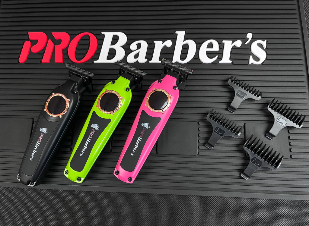 Black, lime green and pink electric hair trimmers with LED displays and three guide combs on a black mat.