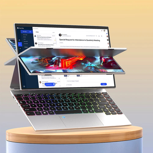 Silver 14-inch 360-degree laptop with a vibrant backlit keyboard, shown in a folded position on a wooden stand.