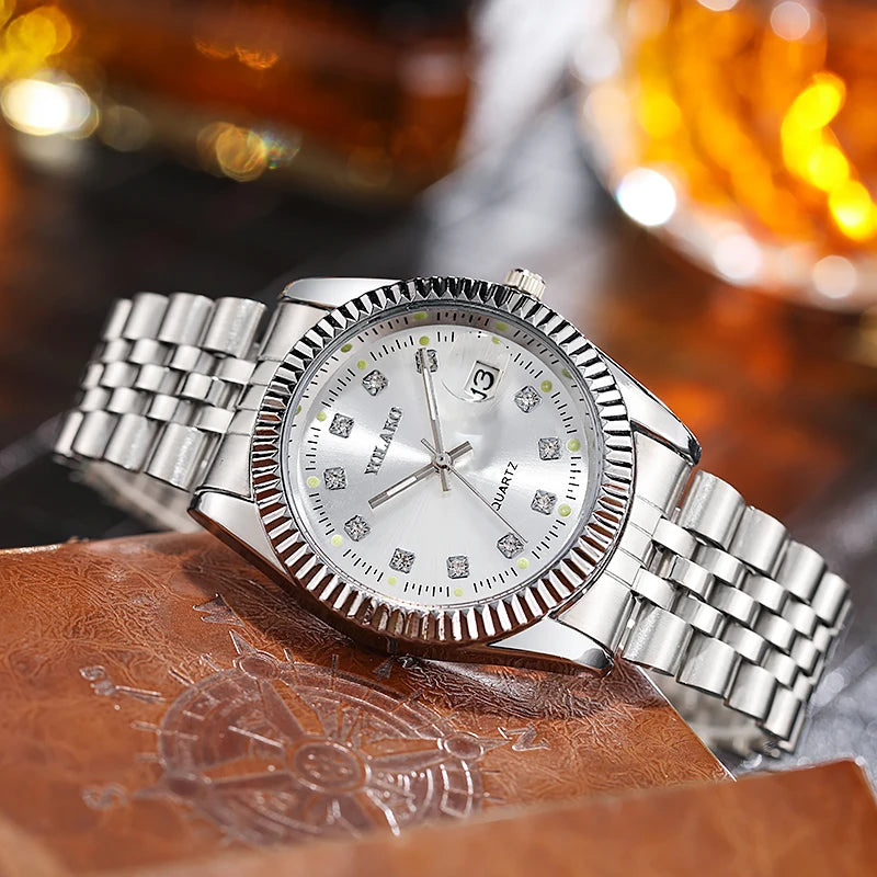 Men's luxury silver-tone quartz watch with a fluted bezel, diamond-style hour markers, and a date display.