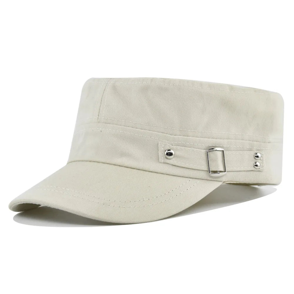 Cream-coloured unisex military-style flat cap with a stiff peak and a decorative side strap featuring silver buckles.