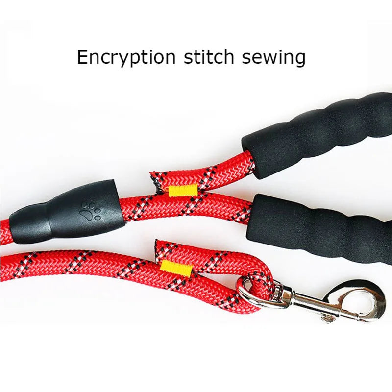 Red reflective rope dog leash featuring a comfortable black padded handle, heavy-duty stitching, and a metal clip.