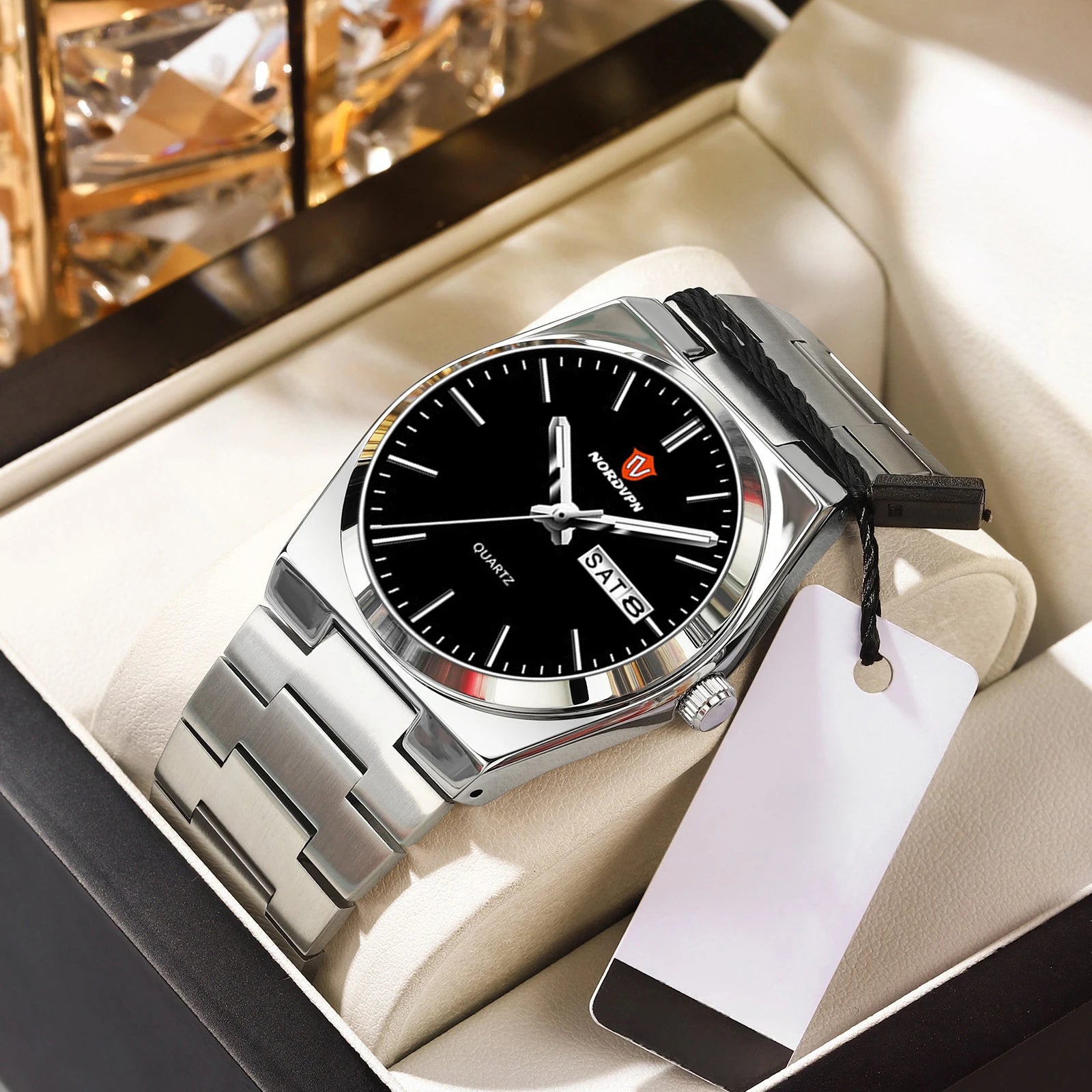 Elegant ultra-thin quartz watch with a black dial, silver stainless steel strap, and day-date display in a gift box.