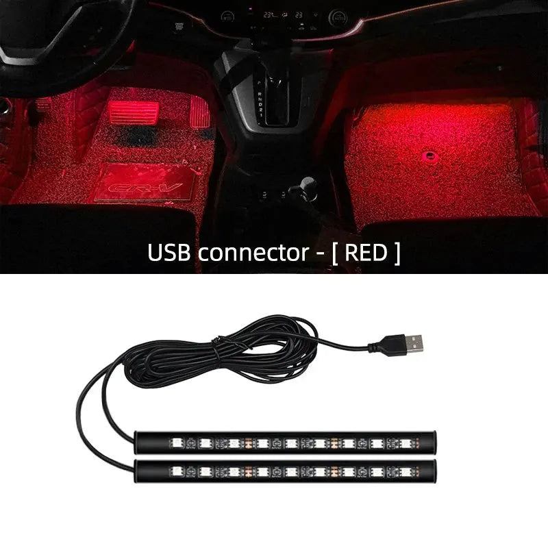 Two black LED footwell strip lights with coiled USB cable, glowing red in a car interior.