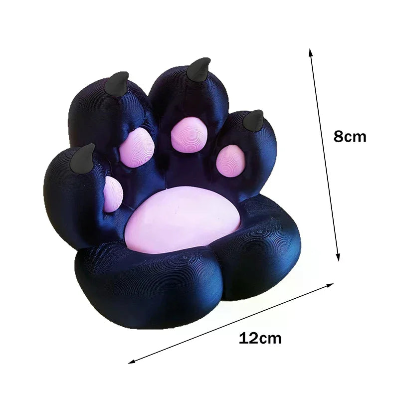 3D-printed black cat paw display stand with pink pads, 12cm wide by 8cm high.