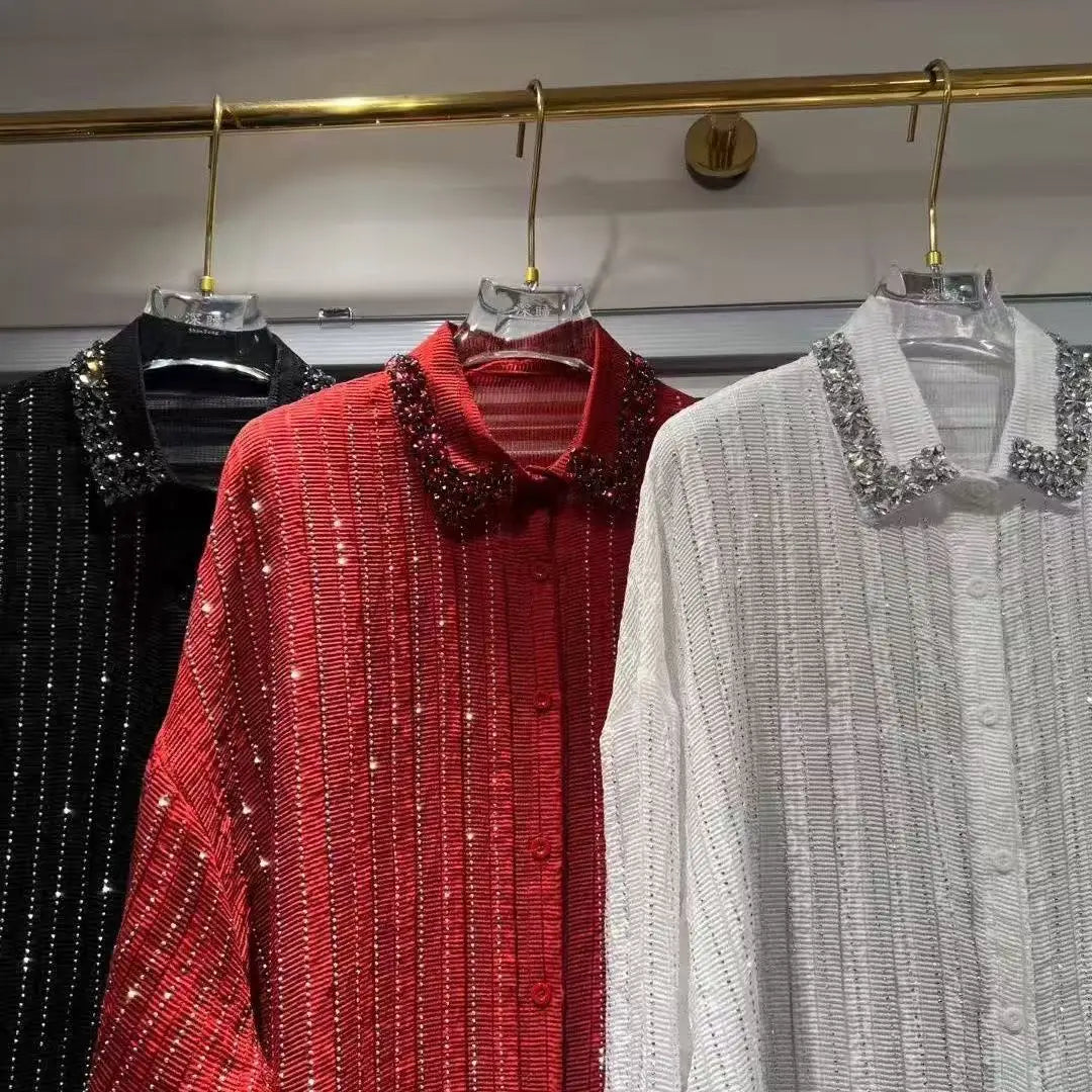 Three button-down shirts in black, red, and white, featuring shimmering vertical stripes and crystal-embellished collars.