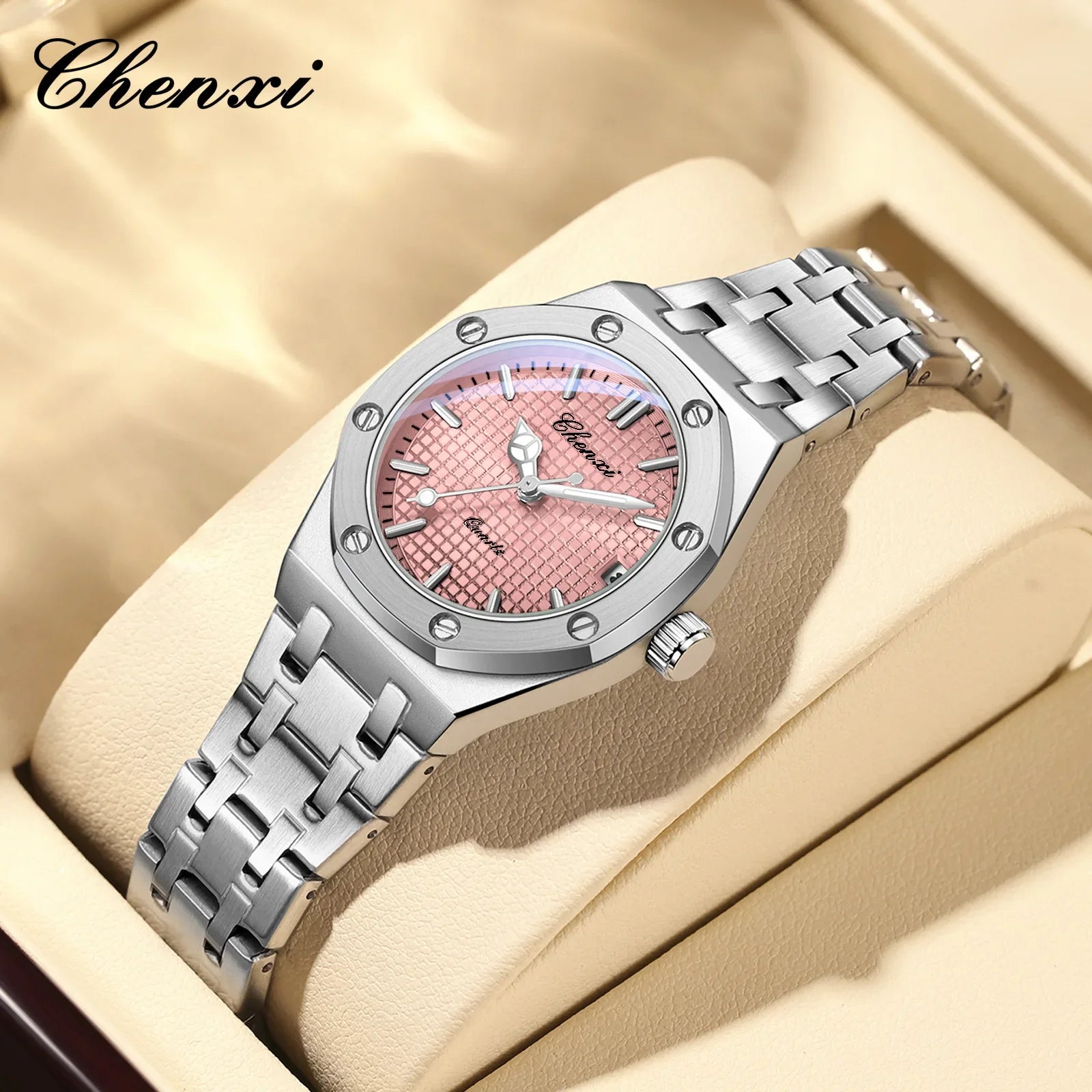 Elegant women's analogue watch featuring a silver stainless steel bracelet and a textured pink dial.