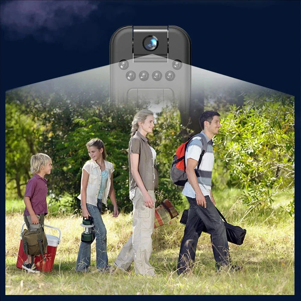 Black plastic mini camera with infrared LEDs, shown projecting a field of view over a family hiking outdoors.