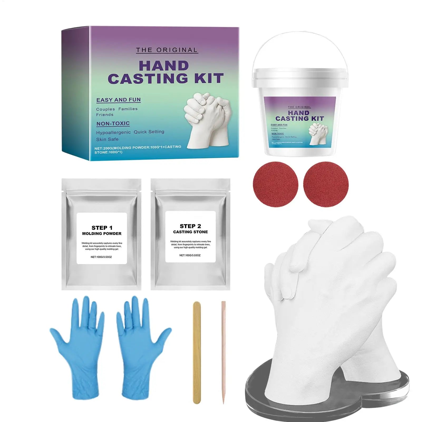 Hand casting kit including moulding powder, casting stone, mixing bucket, gloves, tools, and a finished hand sculpture.