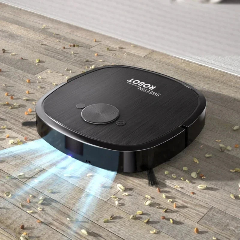 Black robot vacuum cleaner on wood floor, with light beams pointing forward at scattered debris.