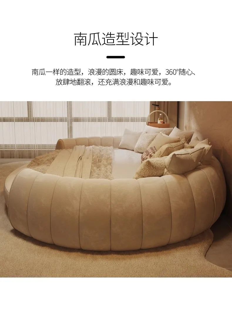 A cream-coloured, circular pumpkin-shaped bed with soft, tufted upholstery, styled for a modern bedroom.