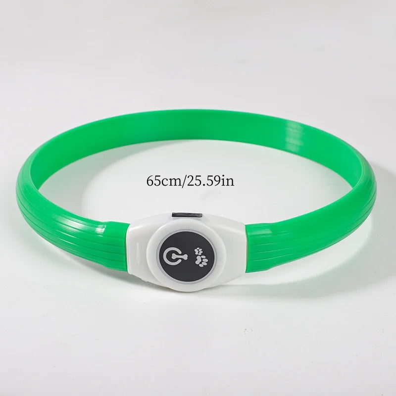 Bright green LED dog collar with a white power button featuring paw print and bone icons. 65cm adjustable design.