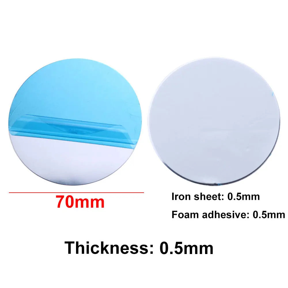 Two 70mm circular metal adhesive mounting discs, one with a blue protective film, on a white background.