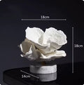 White coral sculpture with width and height of 18cm and base diameter of 14cm.
