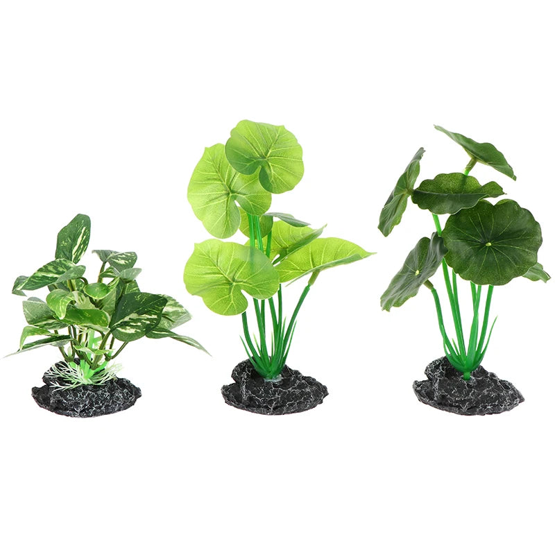 Three artificial aquarium plants with sturdy stems and textured rock bases, shown in varying green leaf styles.