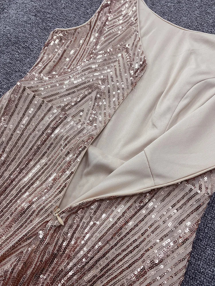 Gold sequin evening dress, sleeveless bodice with lined interior and back zipper.