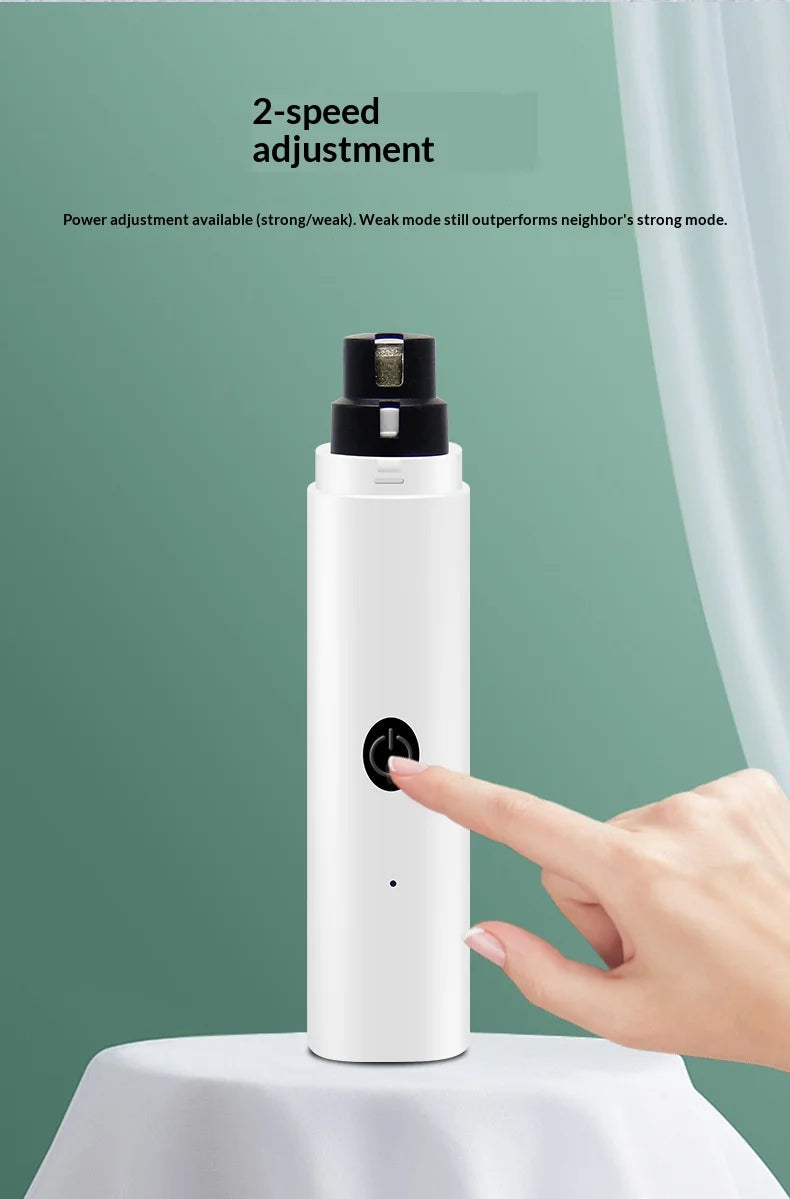 White electric pet nail grinder with a black power button being pressed, featuring 2-speed settings.