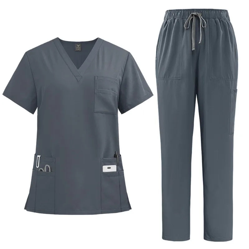 Women's charcoal grey scrub set: V-neck top with multiple utility pockets and matching drawstring trousers.