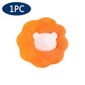 A single orange bath sponge with a raised, pale pink cartoon bear face in the centre.