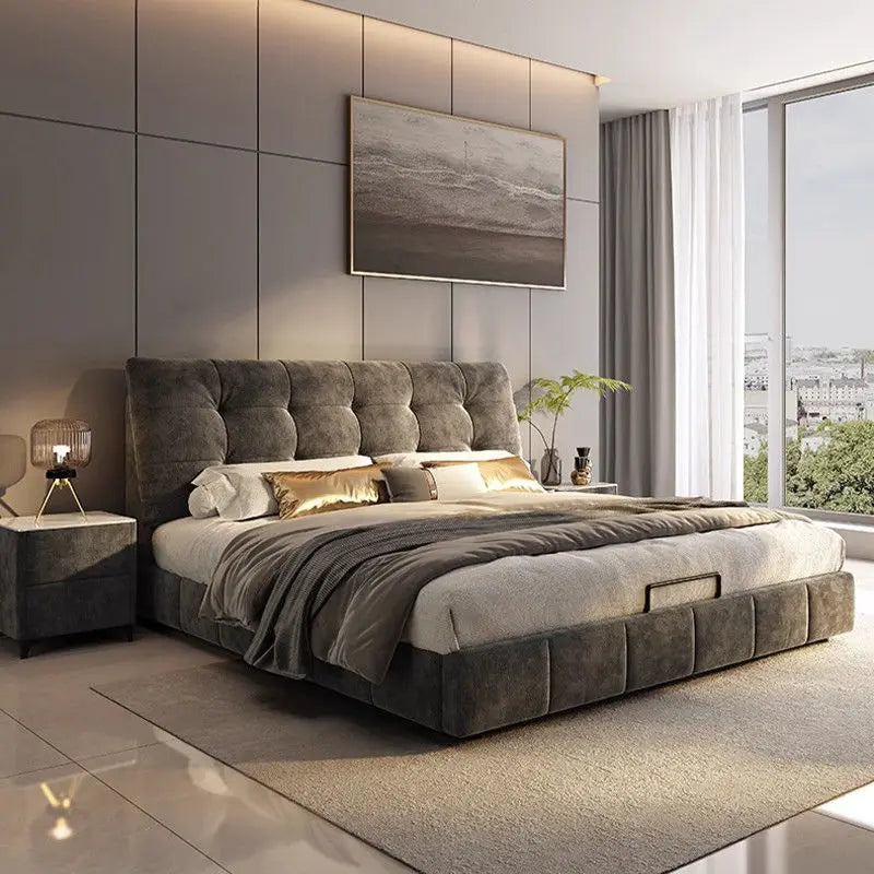 A modern, charcoal grey upholstered bed frame with a tufted headboard and matching side table in a luxury bedroom.