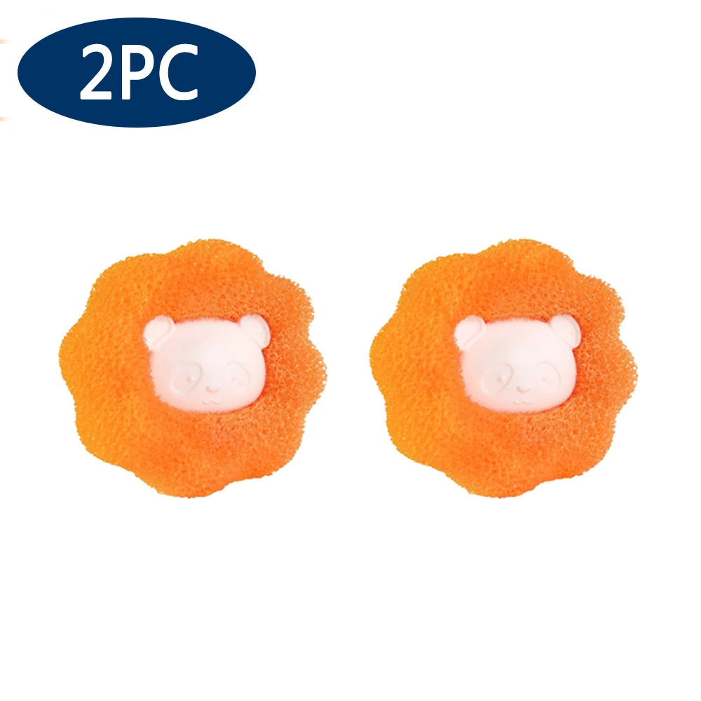 Set of two orange, flower-shaped sponges featuring a cute, light pink panda face in the centre.