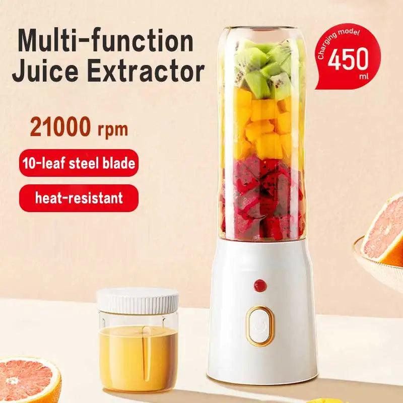 Portable 450ml white electric juice blender filled with colorful chopped fruit. Includes a small matching storage cup.