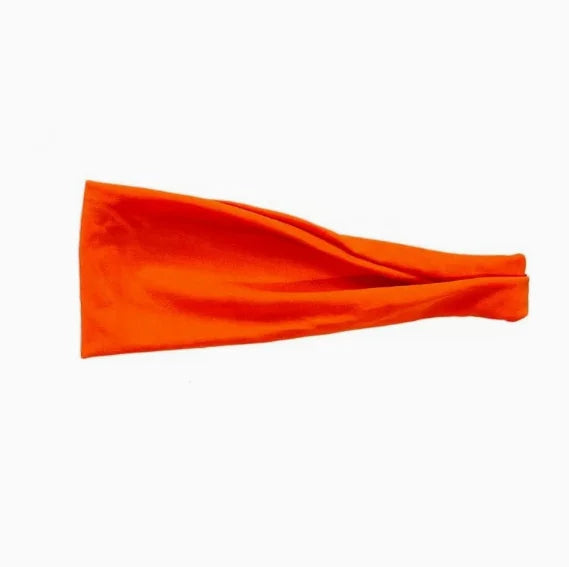 A bright orange, wide fabric headband with a soft, matte finish on a plain white background.