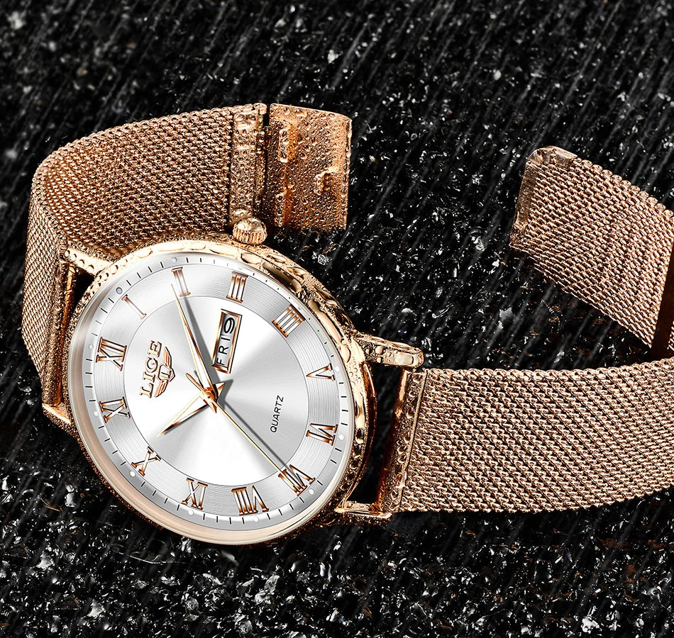 Elegant women’s rose gold mesh bracelet watch with a silver sunray dial, Roman numerals, and a day-date display.
