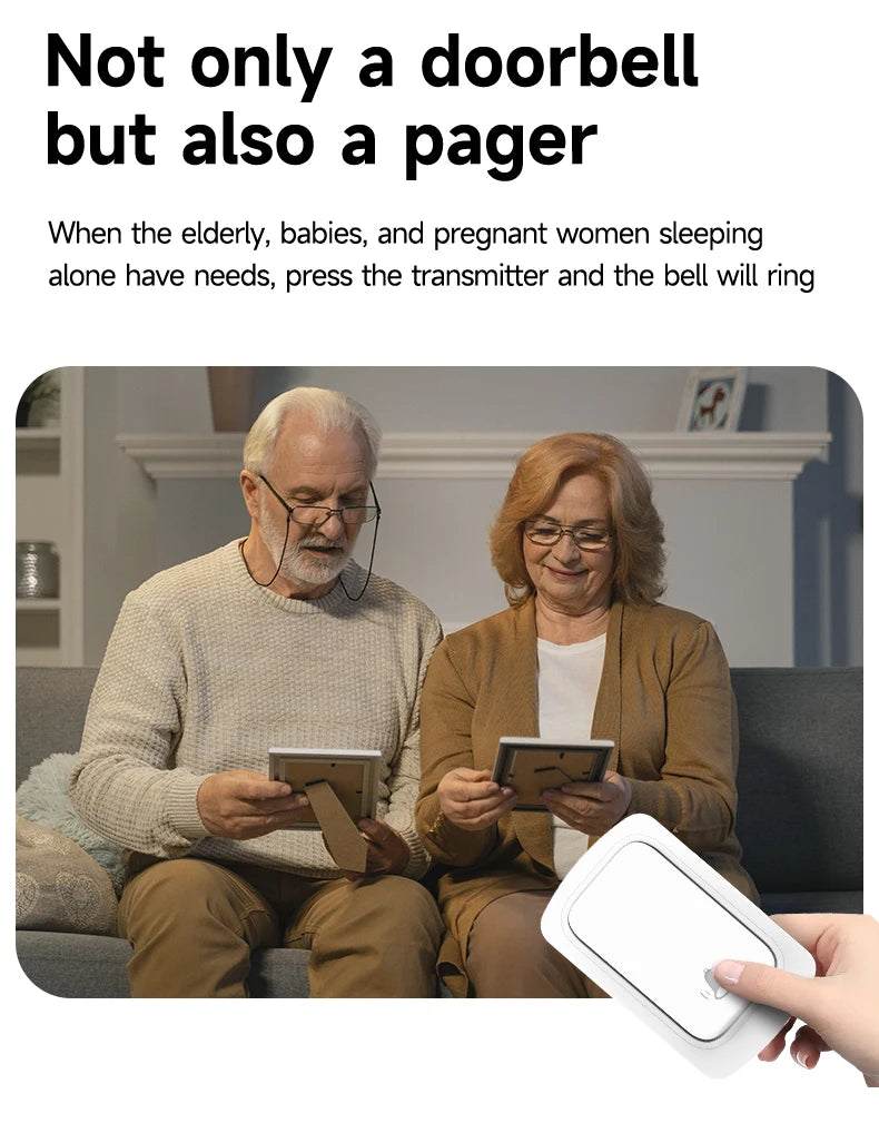 A hand holding a sleek, white, wireless, self-powered doorbell transmitter with a bell icon.