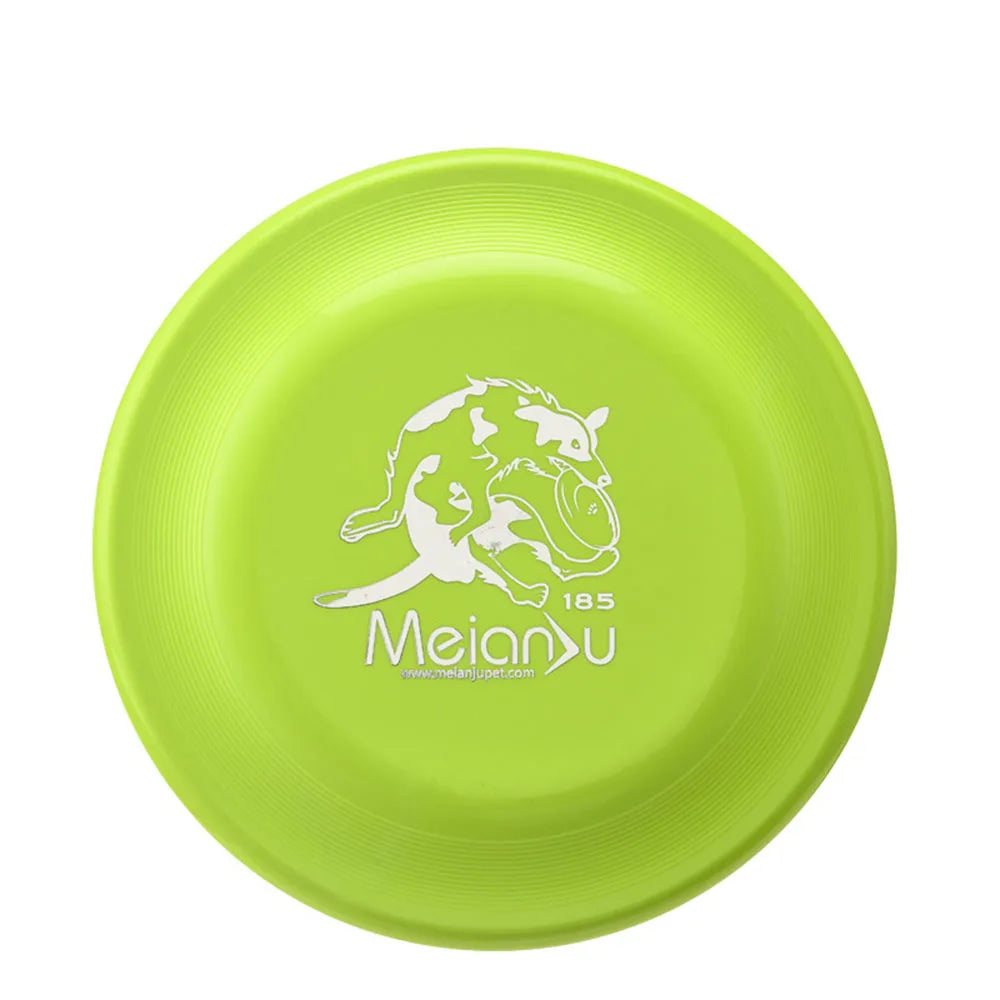 Bright lime green dog training flying disc featuring a white illustration of a dog catching a frisbee.