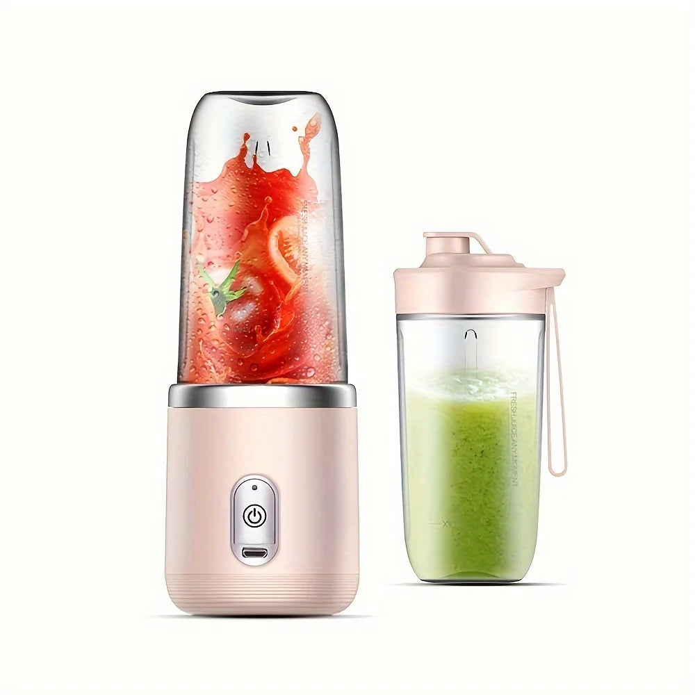 Portable pink personal blender with a clear cup containing a fruit smoothie and an extra travel bottle lid.