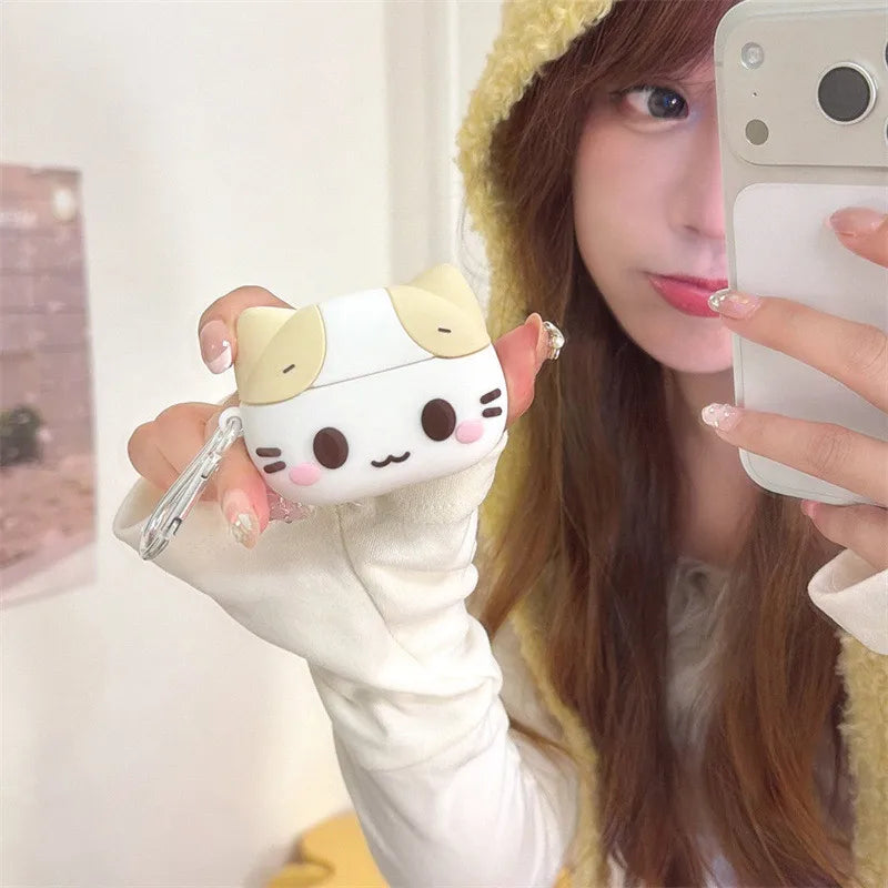 White and yellow silicone cat-themed AirPods Pro protective case with a metal carabiner clip.
