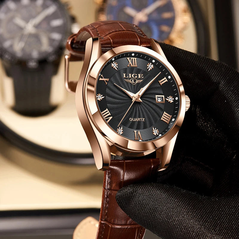 Elegant quartz watch with a rose gold case, black sunray dial, crystal hour markers, and brown leather strap.