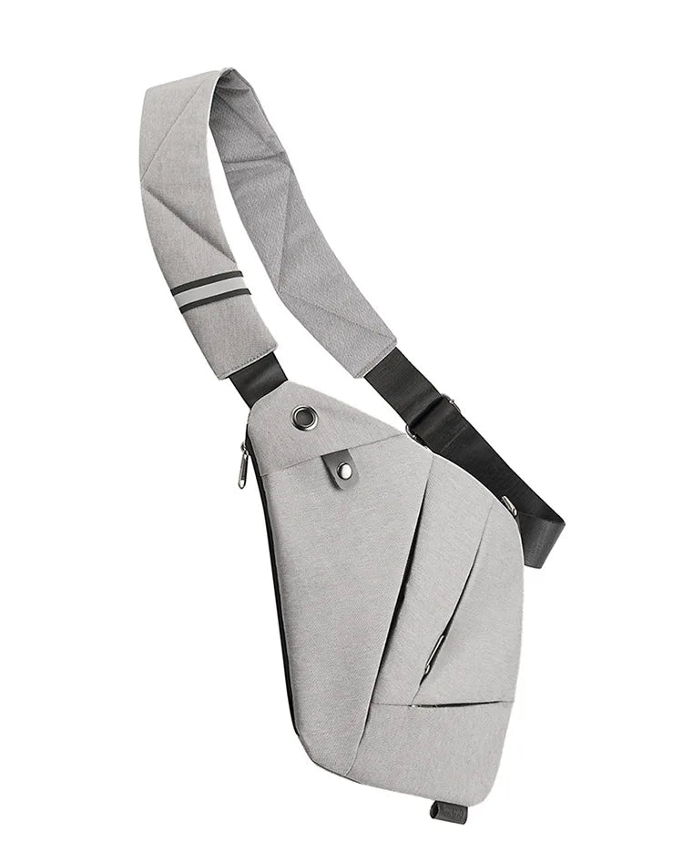 Light grey, slimline anti-theft crossbody messenger bag with an adjustable strap and a secure zip pocket.