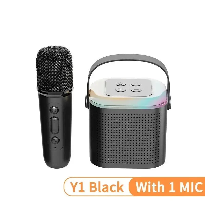 Black portable karaoke speaker with handle, colourful RGB light ring, and a matching wireless microphone.
