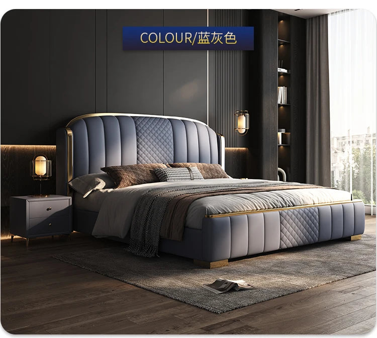 Minimalist blue-grey upholstered bed frame with quilted detailing, curved headboard, and elegant gold-tone metal trim.